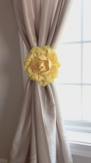 3d Bright Yellow Dahlia Flower Curtain Tie tied around curtain panel in front of window